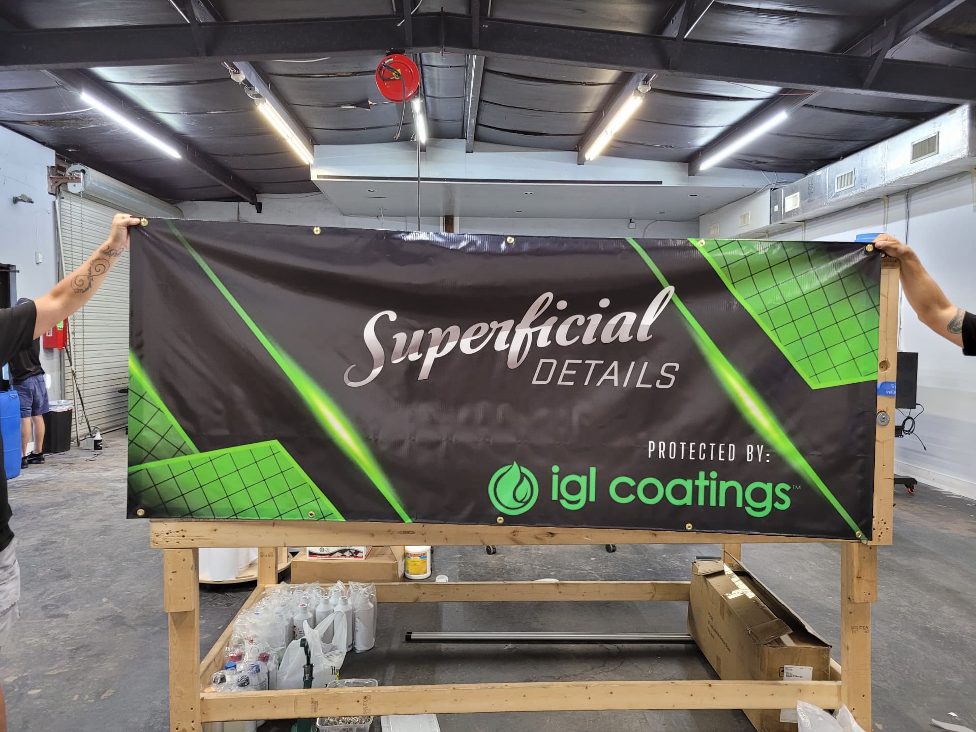 Black and green vinyl banner printed for Superficial Details auto detailing