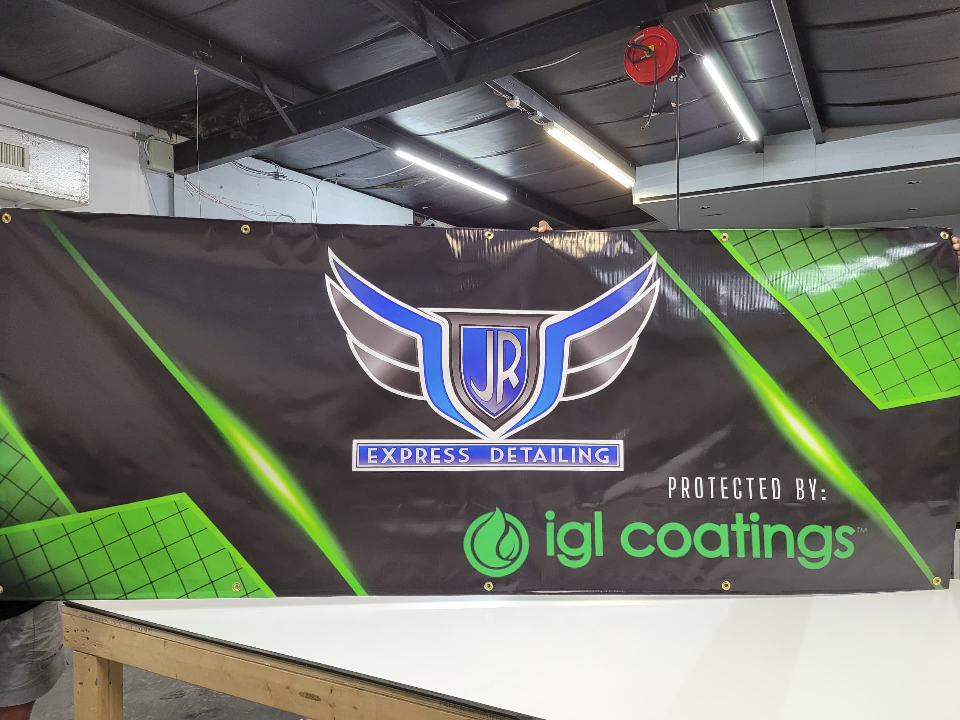 Grommeted vinyl banner printed for JR Express Detailing